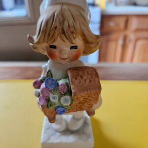 GOEBEL NURSE WTH FLOWERS FIGURINE